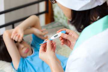 Image showing digital thermometer in the hands of a doctor