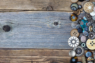 Image showing vintage buttons on aged table