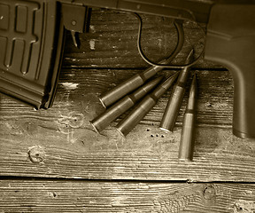 Image showing sniper rifle and five cartridges