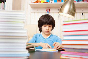 Image showing child reading a book
