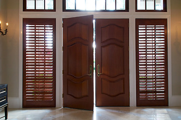 Image showing door ajar with light shining in