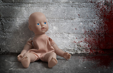 Image showing Concept of child abuse - Bloody doll