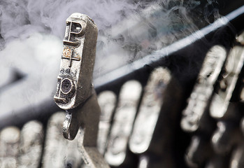 Image showing P hammer - old manual typewriter - mystery smoke