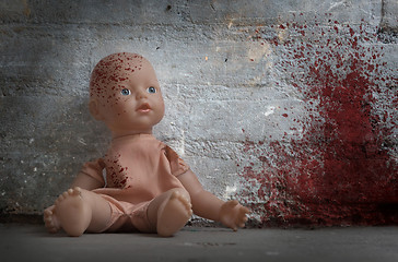 Image showing Concept of child abuse - Bloody doll