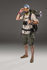 Image showing Full length portrait of a male fully equipped tourist 