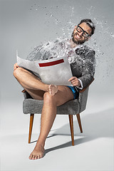 Image showing Man reading newspaper on gray background