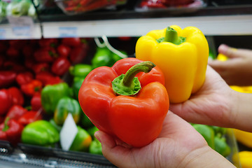 Image showing Colorful bell peppers display at a farmers market