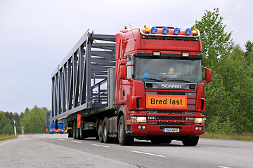 Image showing Scania 164L 580 Semi Truck Hauls a Wide Load