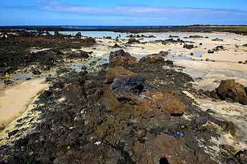 Image showing people footstep coaststone  volcanic spain   