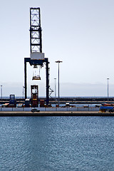 Image showing spain crane and harbor pier boat in the blue sky    