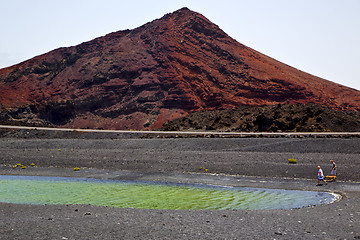 Image showing people dog stone  atlantic ocean sky  water lanzarote in el golf