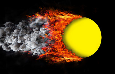 Image showing Ball with a trail of fire and smoke - yellow