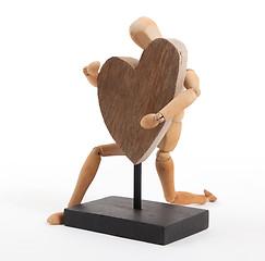 Image showing Wooden mannequin with a big heart