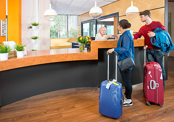 Image showing young travelers at hotel check in