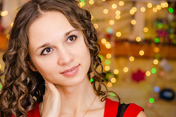 Image showing Portrait of girl on a background blurred lights