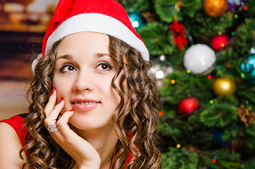 Image showing Portrait of dreaming girl in a Christmas setting