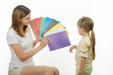 Image showing Girl finds it difficult to pick the color