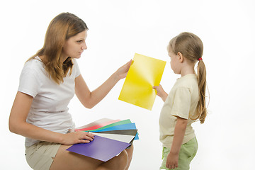 Image showing Upset girl takes a picture with yellow