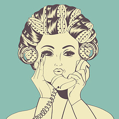 Image showing Woman with curlers in their hair talking at phone