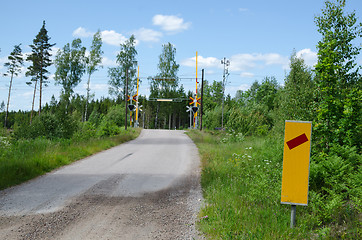 Image showing Traffic sign at a railroad crossing