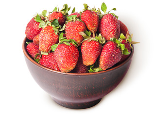 Image showing Ripe juicy strawberries in a ceramic bowl top view