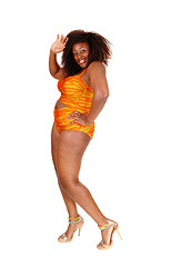 Image showing African woman in bikini waiving hand.