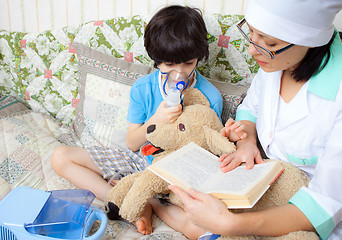 Image showing doctor pediatrician spends boy inhalation session