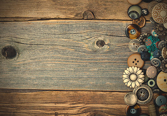 Image showing vintage buttons on aged table