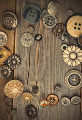 Image showing vintage buttons on old wooden boards