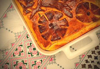 Image showing cabbage pie on the embroidered cloth. Russian cuisine