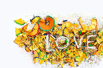 Image showing word Love on background of colored pencils shaving