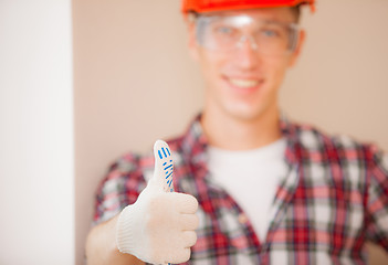 Image showing worker showing thumb up