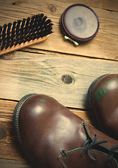 Image showing boots, shoe polish and shoe brush