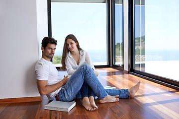 Image showing relaxed young couple at home staircase