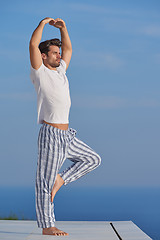 Image showing young man practicing yoga