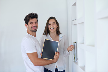 Image showing relaxed young couple at home staircase