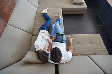 Image showing couple at modern home using tablet computer