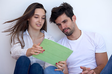 Image showing couple at modern home using tablet computer