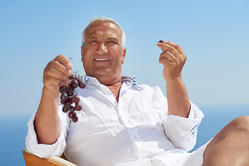 Image showing senior man sitting outside