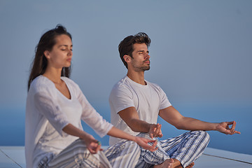 Image showing young couple practicing yoga