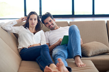 Image showing couple at modern home using tablet computer