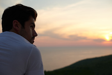 Image showing relaxed young man at home on balcony