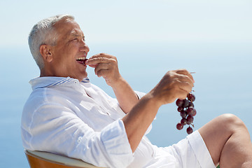 Image showing senior man sitting outside