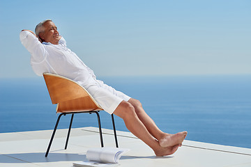 Image showing senior man sitting outside