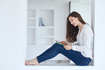 Image showing woman at home using tablet