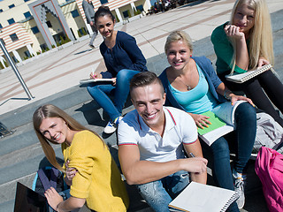 Image showing students outside sitting on steps