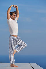 Image showing young man practicing yoga