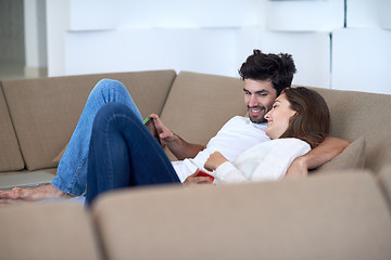 Image showing couple at modern home using tablet computer