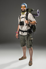 Image showing Full length portrait of a male fully equipped tourist 