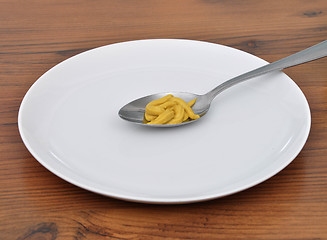 Image showing Spoon with mustard